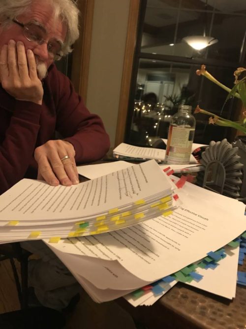 Fueled by his favorite Gingerade Kombucha, Roger is looking at dozens of colored edit tabs on the book manuscript